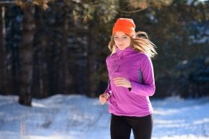 woman running in the snow