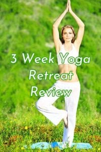 Pretty redheaded woman doing a standing yoga pose
