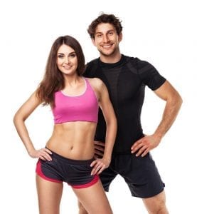 Fit man and woman in workout gear