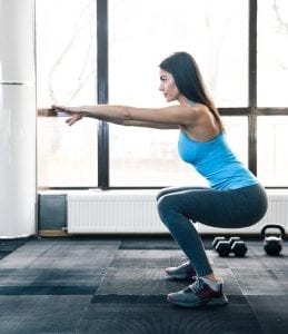 Young woman doing Squats