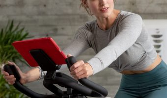 Young woman cycling on a Schwinn IC4 Indoor Exercise BIke