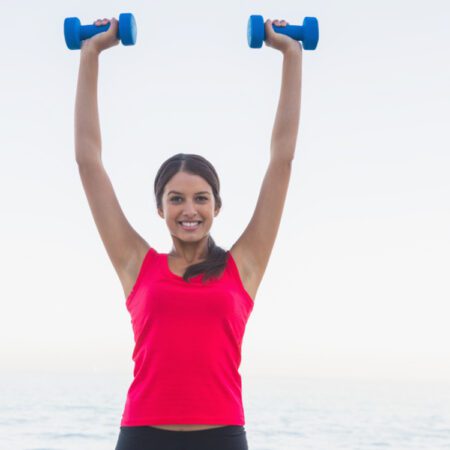 YOung woman doing Man Maker exercise