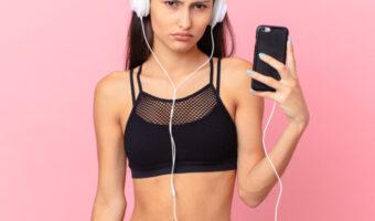 Young woman not happy to be exercising.