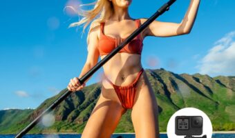Young blonde woman in a red bikini kneeling and paddling a SUP